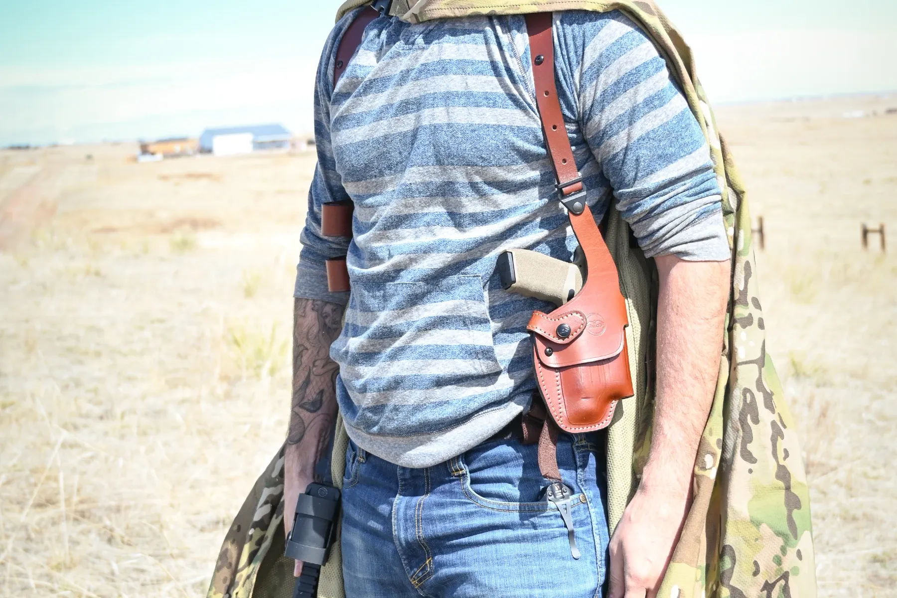 Springfield Hellcat Pro with a light in a shoulder holster