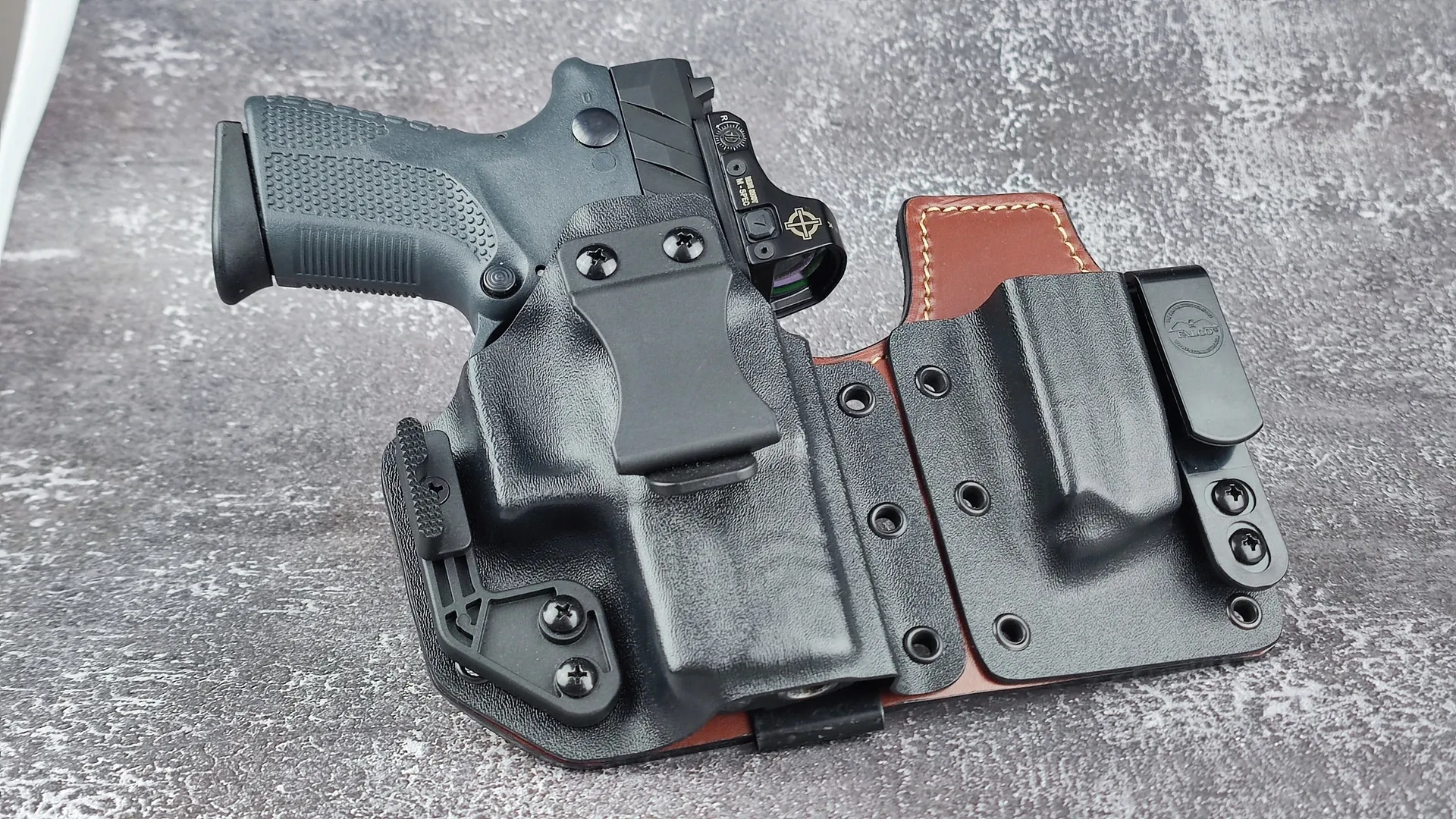 Pistol with a zeroed RDS in a holster