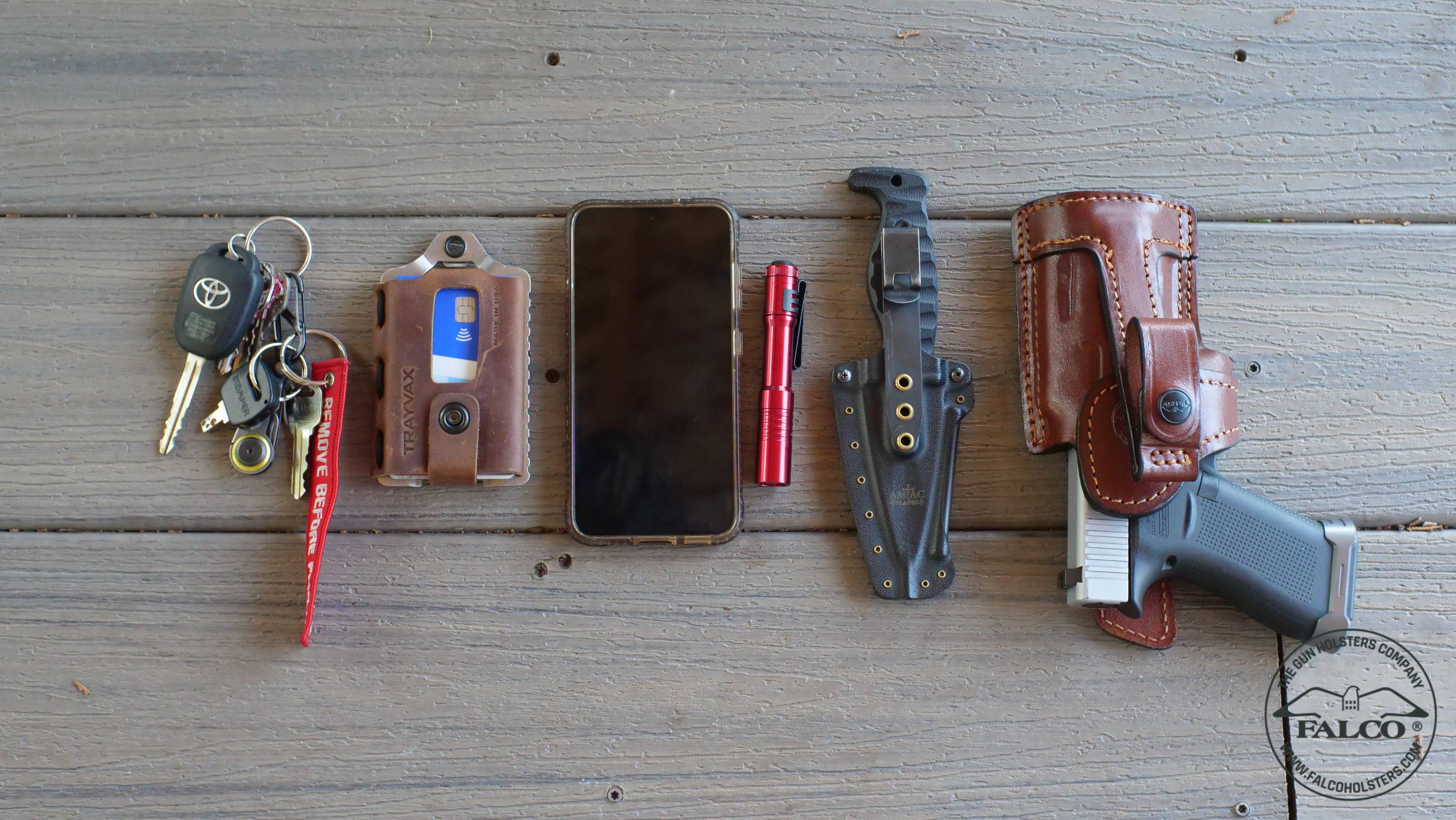 Competition belt with a handgun, holster, magazines, and IFAK